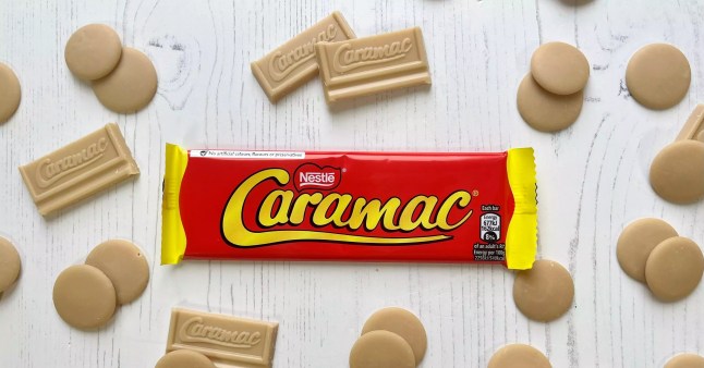 Caramac chocolate bar surrounded by Caramac buttons and chocolate pieces
