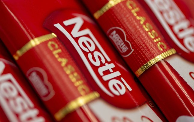 The Nestle logo on a chocolate bar.