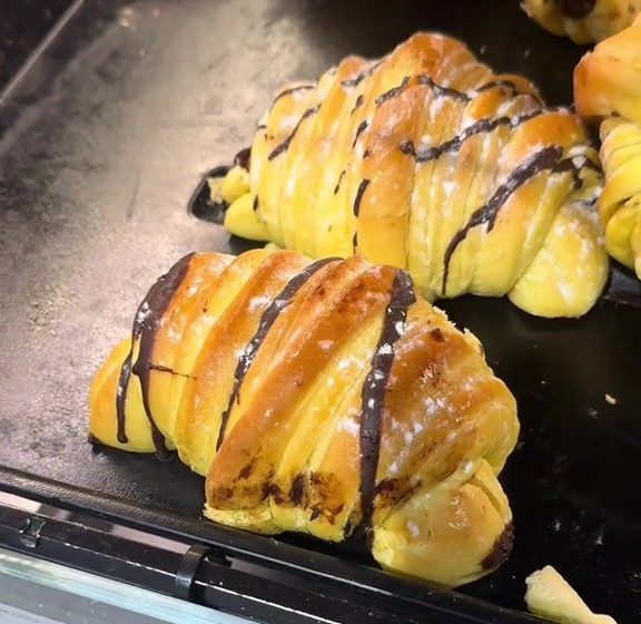 Lidl's new Brioche Chocolate Croissant which features a golden crust dusted with sugar and gooey centre.