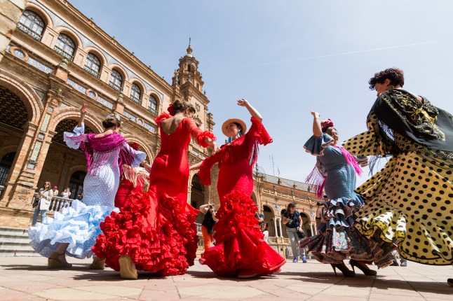 Flamenco dancers dance in the largest square in Seville, Spain