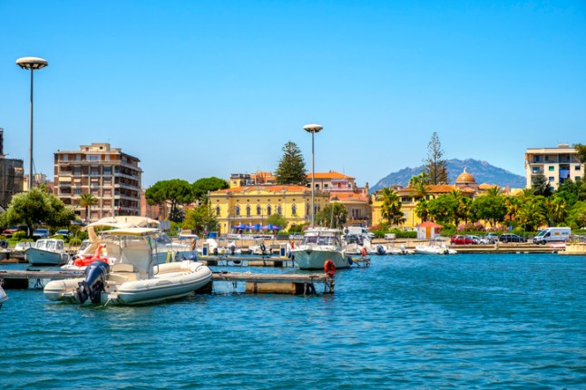 Olbia, Sardinia, Italy - Panoramic view of Olbia port and yacht marina with Citi hall in historic old town quarter
