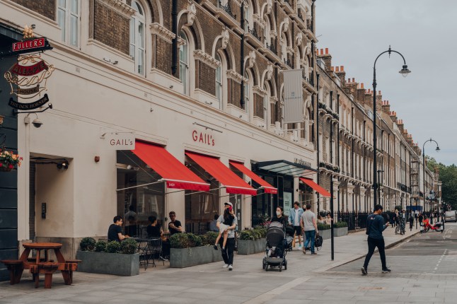The exterior of a Gail's bakery and cafe on a central London street, with people walking by.