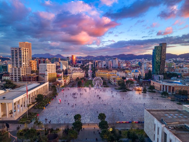 A view over Tirana, Albania's main square Sheshi Skenderbej at sunset.