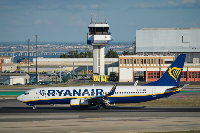 A Ryanair flight on the runway at Lisbon airport.