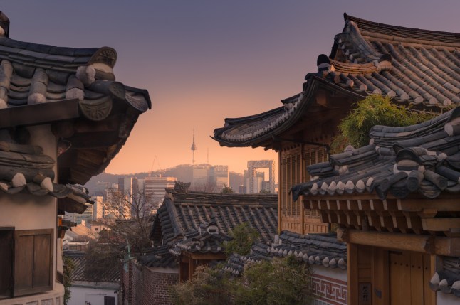 Bukchon Hanok village with Seoul city background
