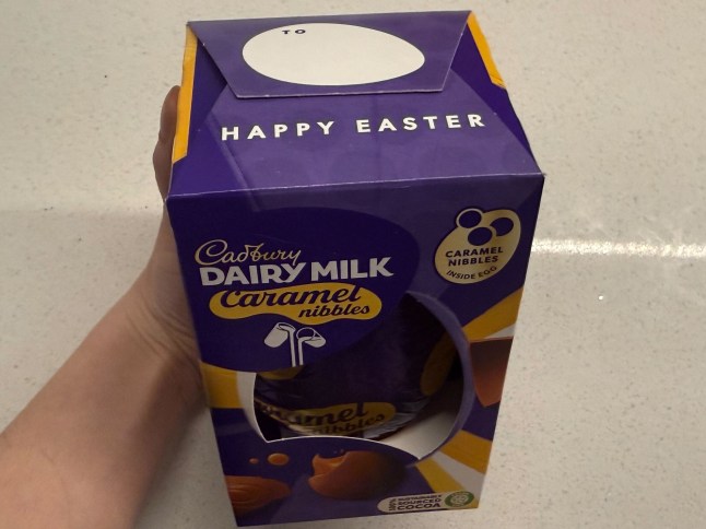 The words 'Happy Easter' can be seen on the top of a Cadbury Dairy Milk Caramel Nibbles Easter egg box