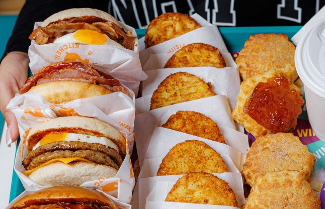 A spread of Popeyes breakfast food on a tray