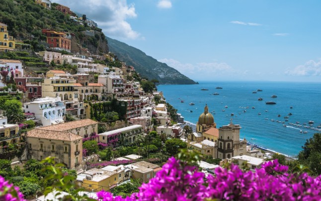 Scenic view of sea by buildings against sky in Salerno on the Amalfi Coast, in Italy