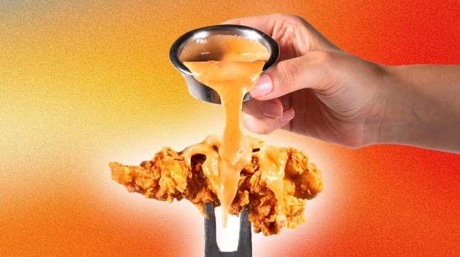 Creamy ranch sauce dripping over a chicken tender.