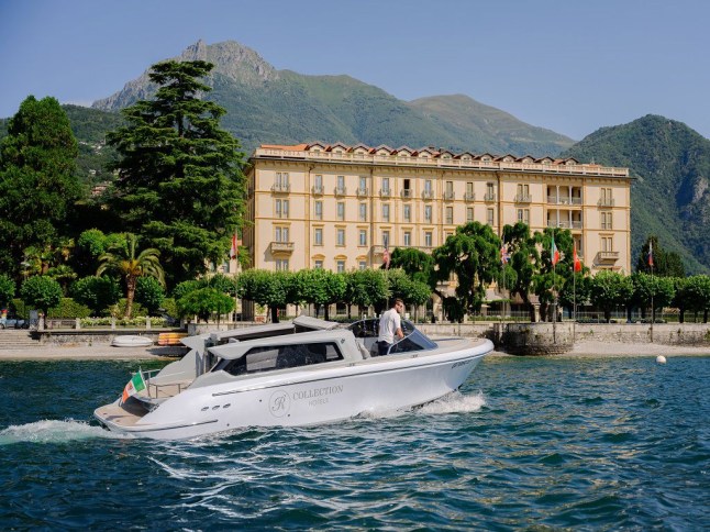 A boat on Lake Como in front of the Grand Hotel Victoria in Menaggio.