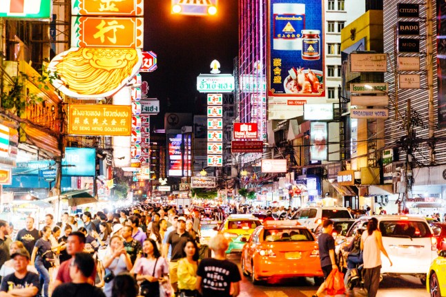 Crowds of people in Chinatown at night, Bangkok, Thailand.