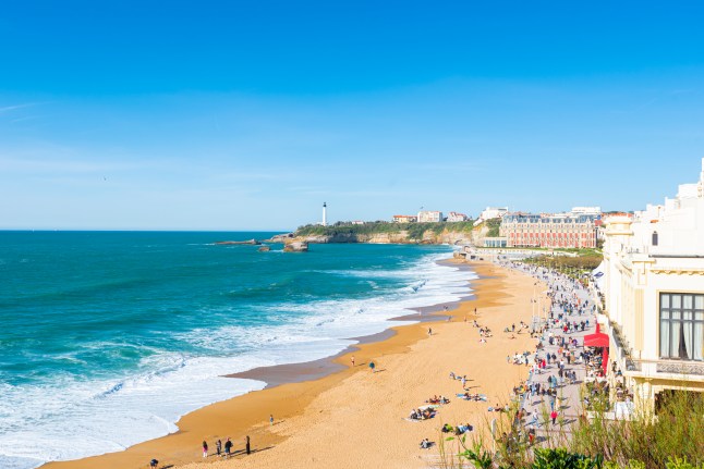 A sunny view of the golden sandy Biarritz Beach in France.
