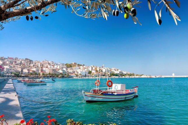 A boat on the water off the Greek island of Crete on a bright, sunny day