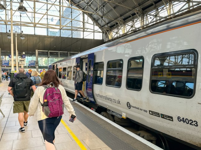 People arriving at Manchester Piccadilly railway station