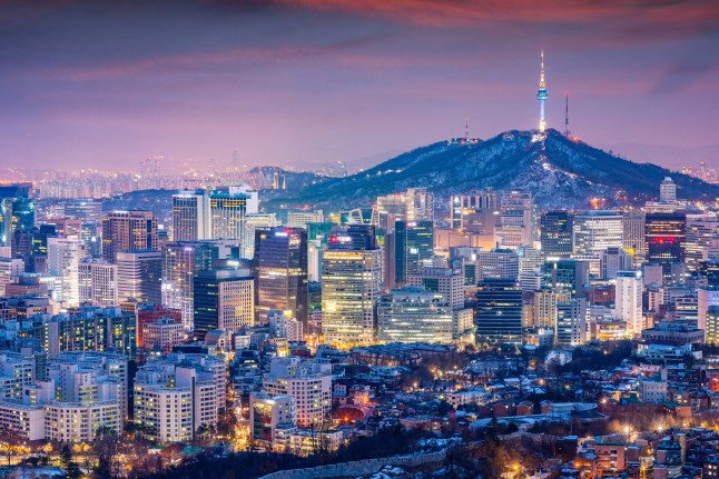 The lit-up skyline of Seoul, South Korea at night.