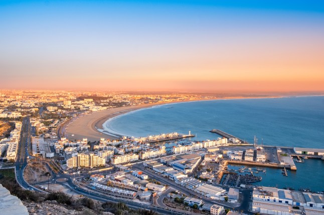 A panoramic view of Agadir city, bay and ocean in southern Morocco, at sunset.