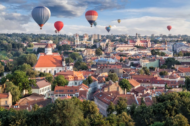 An aerial view of hot air balloons over Vilnius, Lithuania