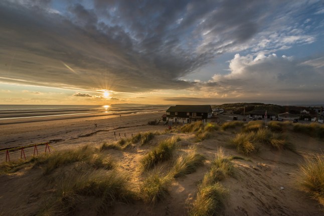 Sandy Beach during sunset in Sussex, England.