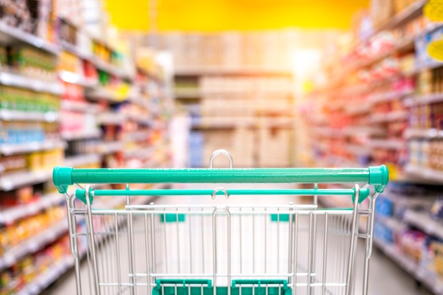 Empty shopping cart in the supermarket shopping mall