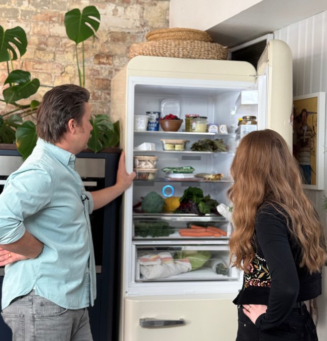Courtney and Jamie Oliver looking inside Jamie's fridge at Jamie Oliver HQ