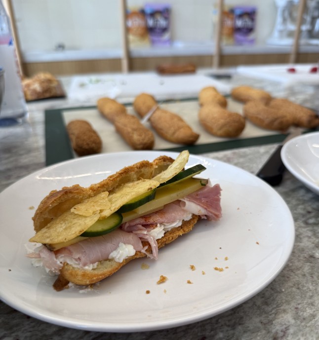 A savoury eclair filled with cheese, ham, cucumber and Kettle Chips crisps