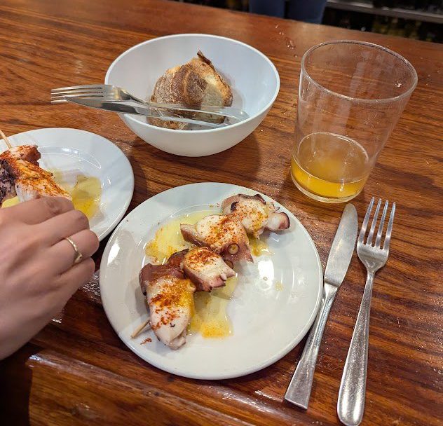 A plate of tapas and a glass of beer